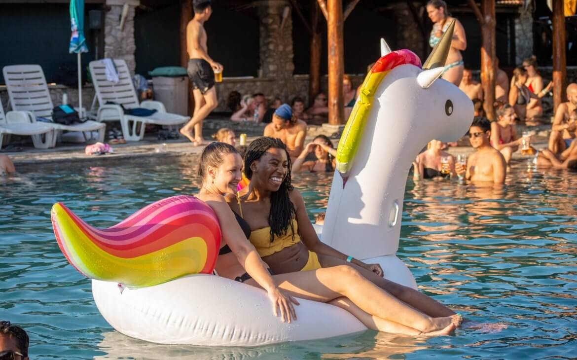 girls hanging out in a pool at Bansko Nomad Fest