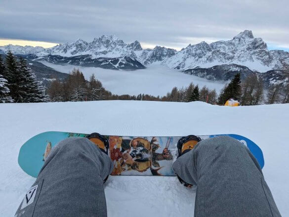 view of a snowboard and the mountains